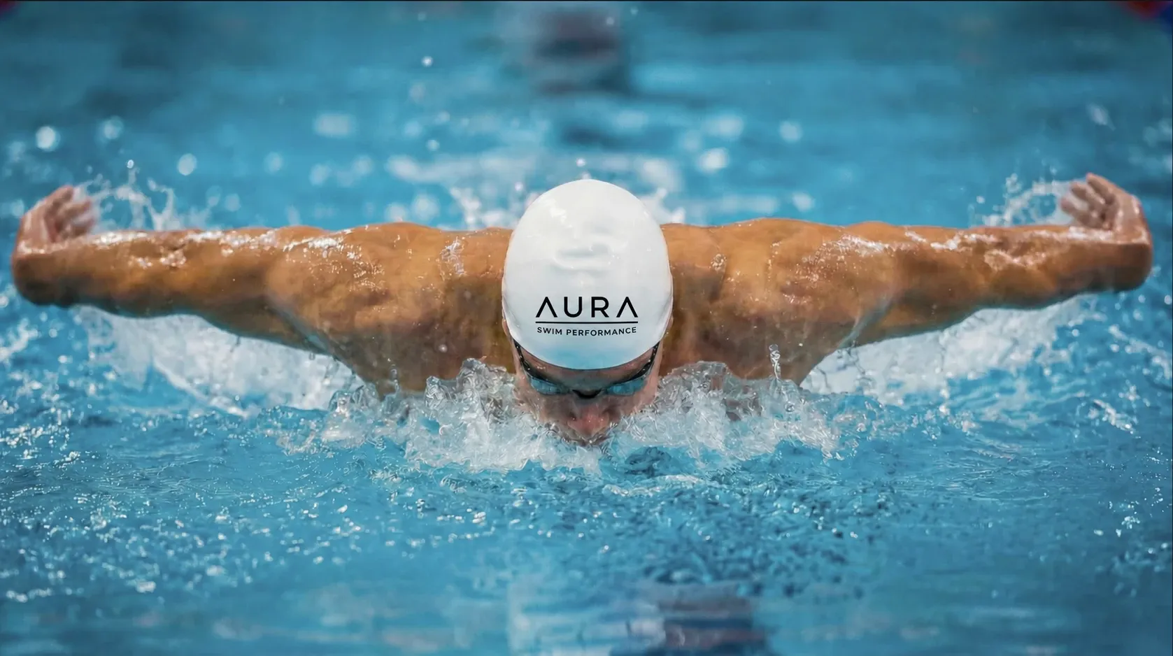 Swimmer moving through the water in a focused butterfly stroke